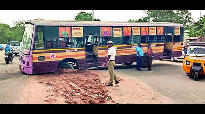 Govt bus, lorry get stuck in open pits on roads, none hurt