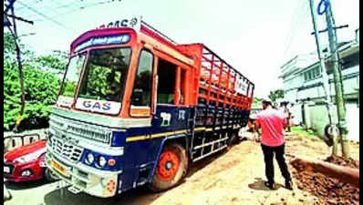 Govt bus, lorry get stuck in open pits on roads, none hurt