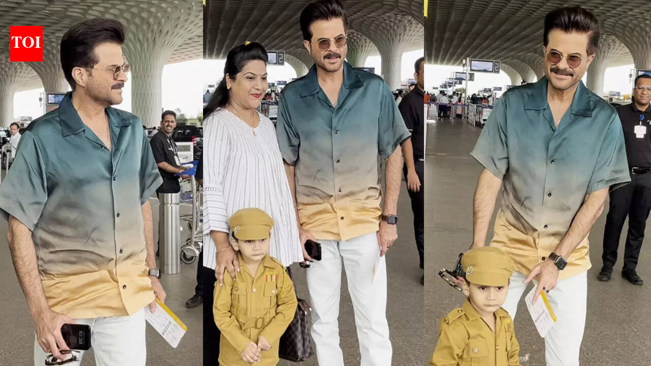 Anil Kapoor poses with a little fan dressed as police officer at airport