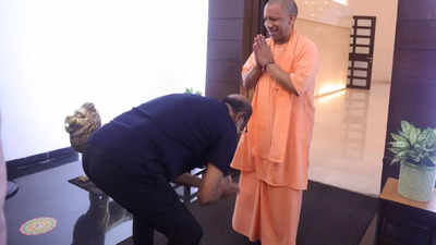 Fans get upset as Rajinikanth touches the feet of UP Chief Minister Yogi Adityanath