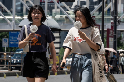 Japanese people dress in clothing with built in fans to combat the heat