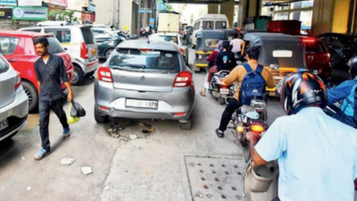 Pune: Parked vehicles on footpaths spell chaos for walkers near Metro stations