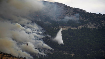 European firefighters and planes join battle against wildfires that have left 20 dead in Greece