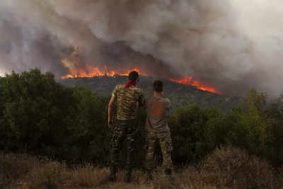 Greek authorities arrest 2 for arson while firefighters battle wildfires across the country