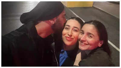 Karisma Kapoor gets a sweet kiss from brother Ranbir Kapoor as she poses with him and Alia Bhatt in New York - See photo