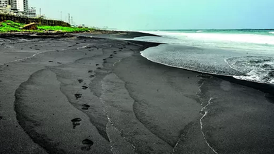 Vizag beach sand turns black, iron dust to blame?