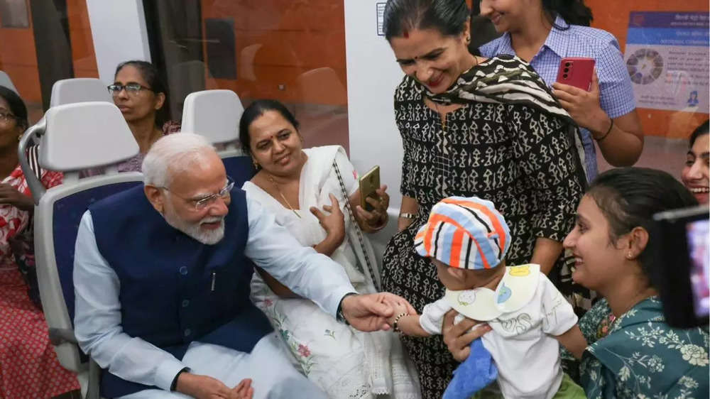 Selfies and smiles: PM Modi travels in Delhi Metro on his birthday