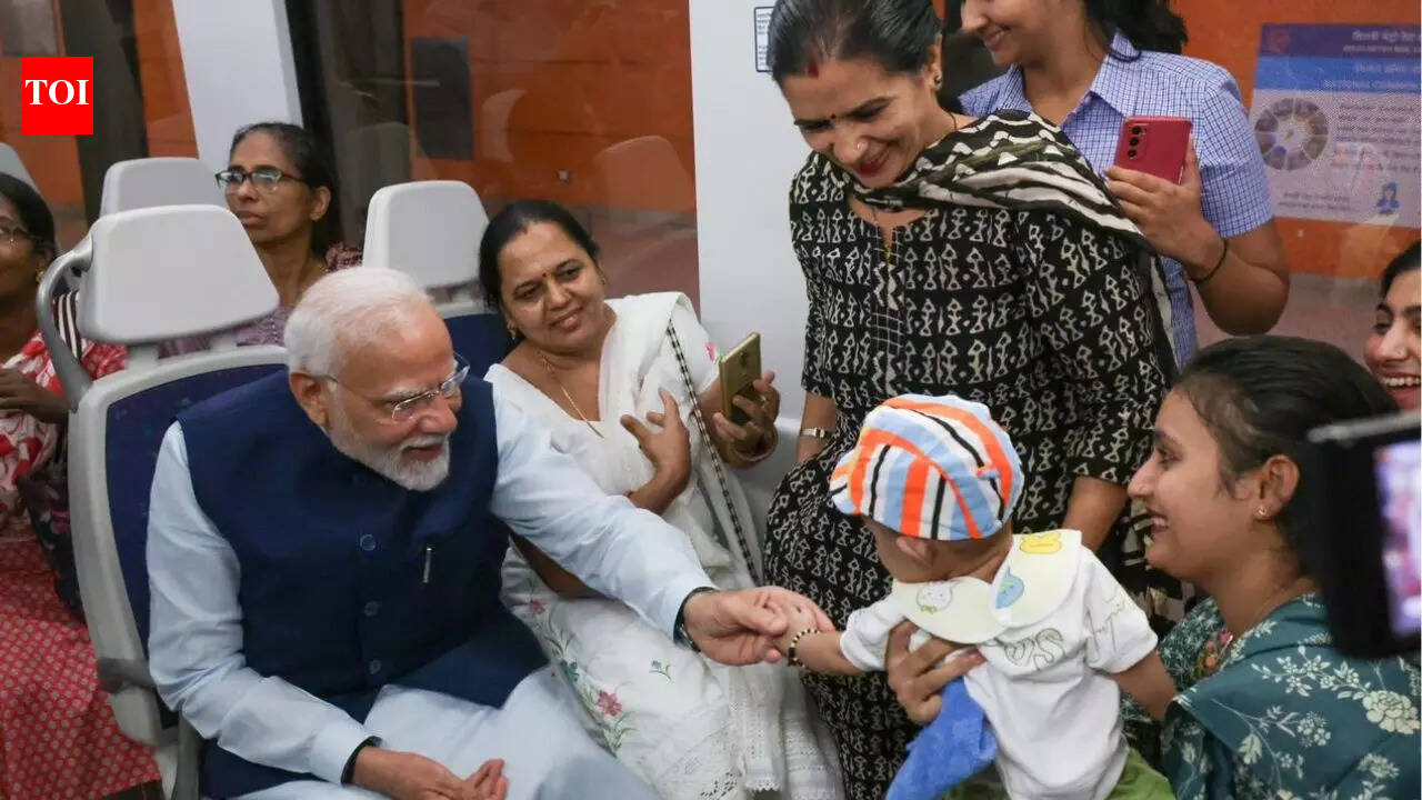 Selfies and smiles: PM Modi travels in Delhi Metro on his birthday