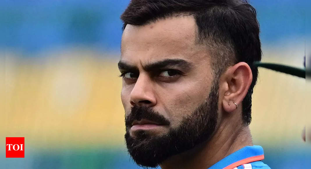 India's captain Virat Kohli smiles as he listens to a question during a  press conference ahead of their Cricket World Cup semifinal match against  New Zealand at Old Trafford in Manchester, England,