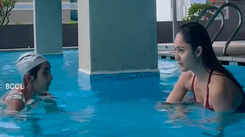 Actress Tridha Choudhury enjoys pool time with a kid