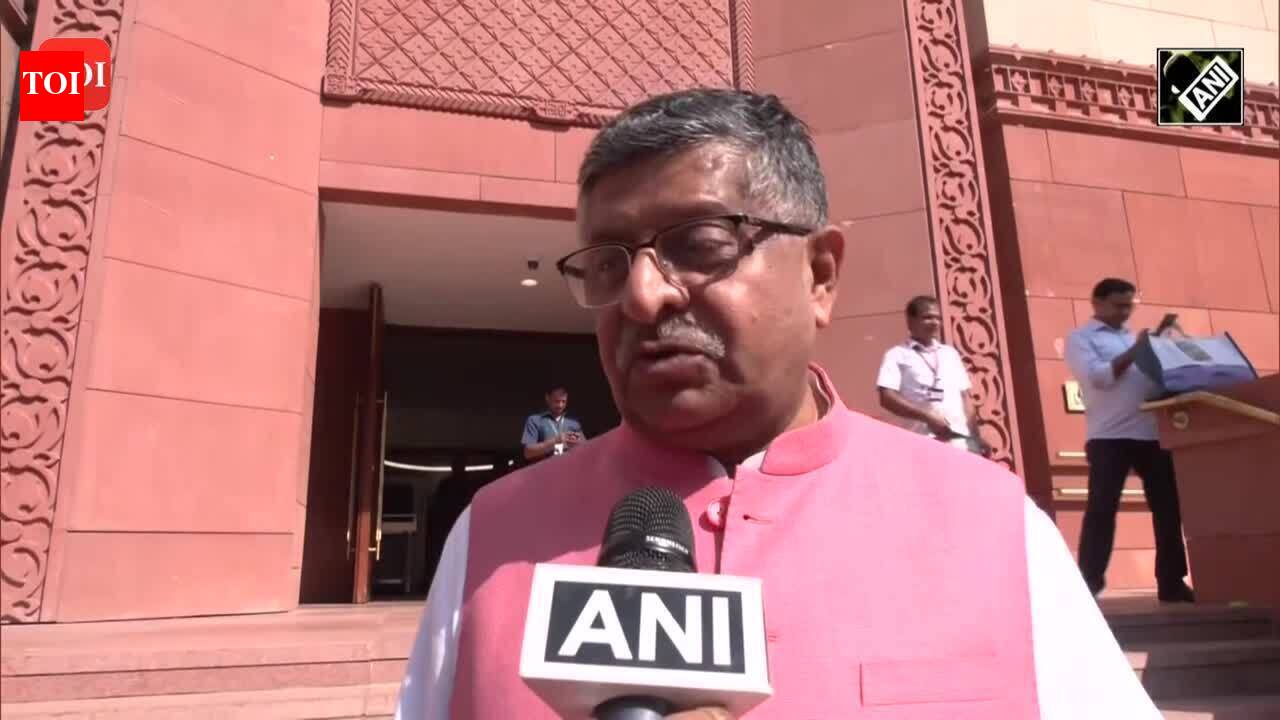 BJP MP Ravi Shankar Prasad celebrates the historic introduction of the ...