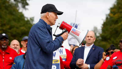 Biden makes history by joining striking US car workers