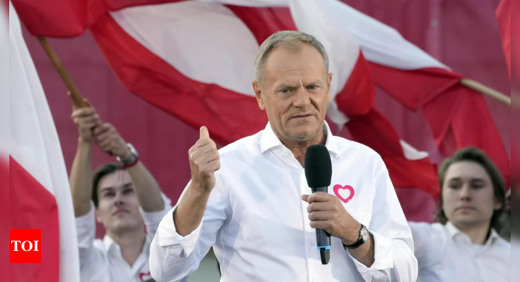 Polish opposition head Donald Tusk leads march to boost chances to unseat conservatives in election