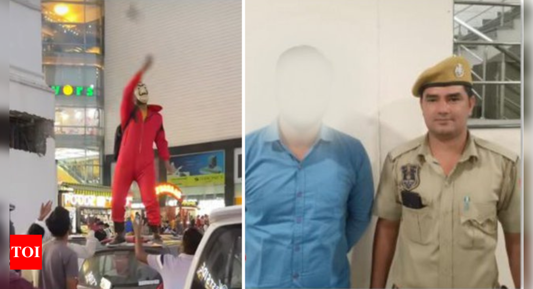 Money Heist: Man dressed as Money Heist character throws money on people from top of car, arrested