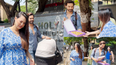 Rochelle Rao and Keith Sequeira take their little daughter home; the duo distributes sweets among the paps