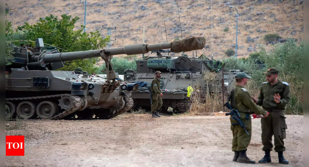 Hezbollah and Israel exchange fire as Israeli soldiers battle Hamas on second day of surprise attack
