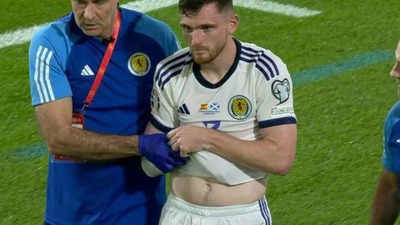 Watch: Liverpool's Andy Robertson forced off with a serious injury in Spain vs Scotland