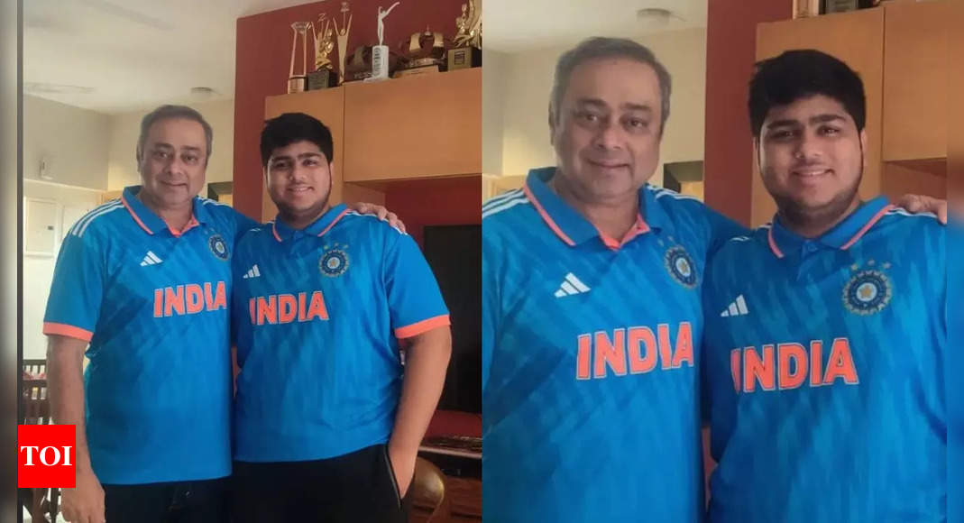 Kon Honaar Crorepati host Sachin Khedekar poses with his son in a blue jersey ahead of the India Vs Pakistan World Cup match
