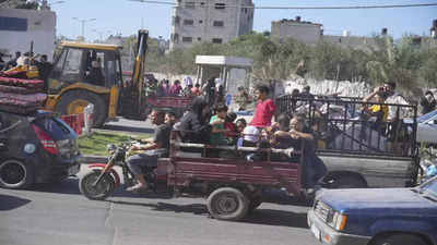 Palestinians stream south in Gaza as Israel urges mass evacuation and conducts brief raids