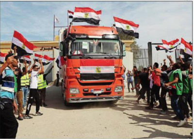After two weeks of siege, aid starts moving into Gaza Strip - Times of ...
