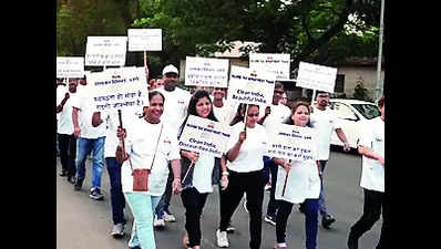 Income tax officials hold walkathon to promote cleanliness