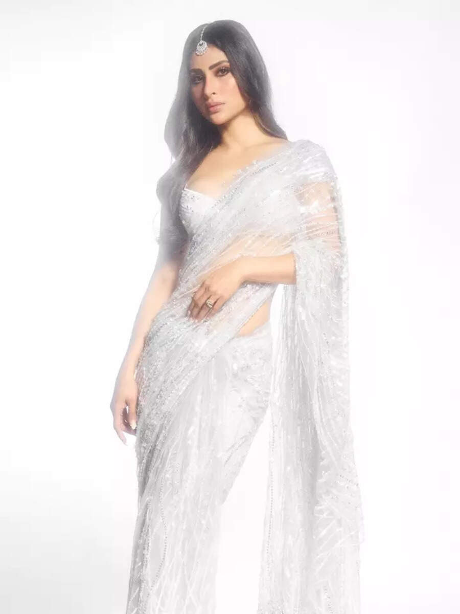 Mouni is a vision in a silver sequin saree