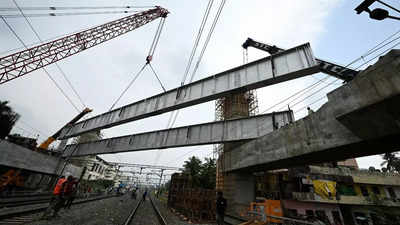 MRTS Phase II: Three steel girders installed across existing tracks near St Thomas Mount station using six giant cranes