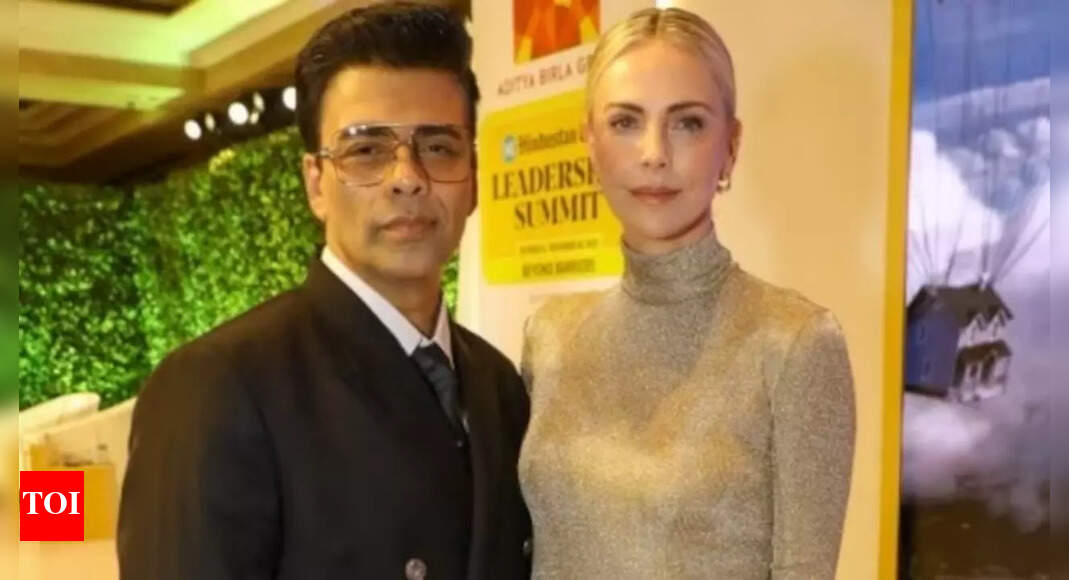 KJo poses with Charlize Theron - view pics