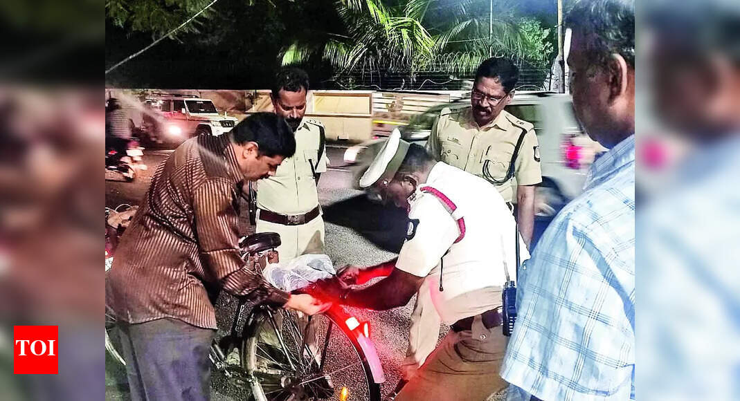 Stick Reflectors Cops Stick Reflectors On Bicycles To Ensure Safety Of