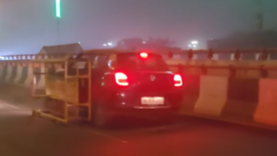 Viral video: Car drags Delhi Police barricade on major flyover!