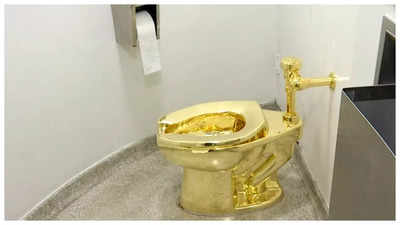 4 men charged in theft of satirical golden toilet titled 'America', at Churchill's birthplace