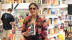 Huma Qureshi poses with her debut novel at a bookstore