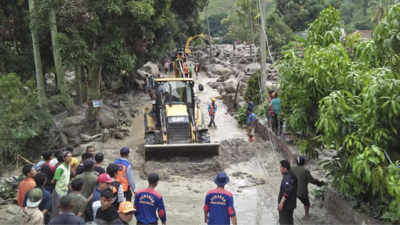 1 person is dead and 11 missing after a landslide and flash floods hit Indonesia's Sumatra island