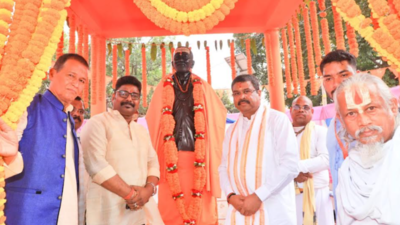 Union education minister Dharmendra Pradhan unveils statue of Laxmanananda Saraswati