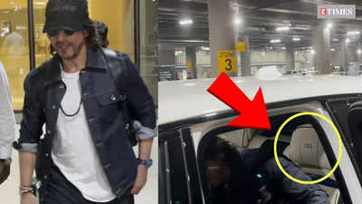 Shah Rukh Khan looks dapper in white t-shirt, denim jacket and trousers, SRK written on car's seat cover steals the spotlight
