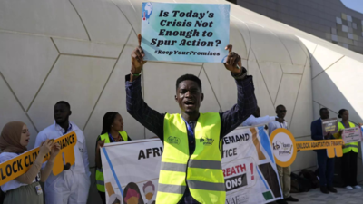 Activists protest against fossil fuel industry at COP28 climate summit