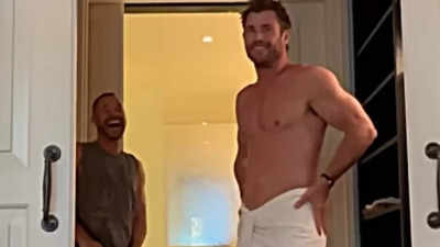 Chris Hemsworth shows off muscles wearing nothing but towel