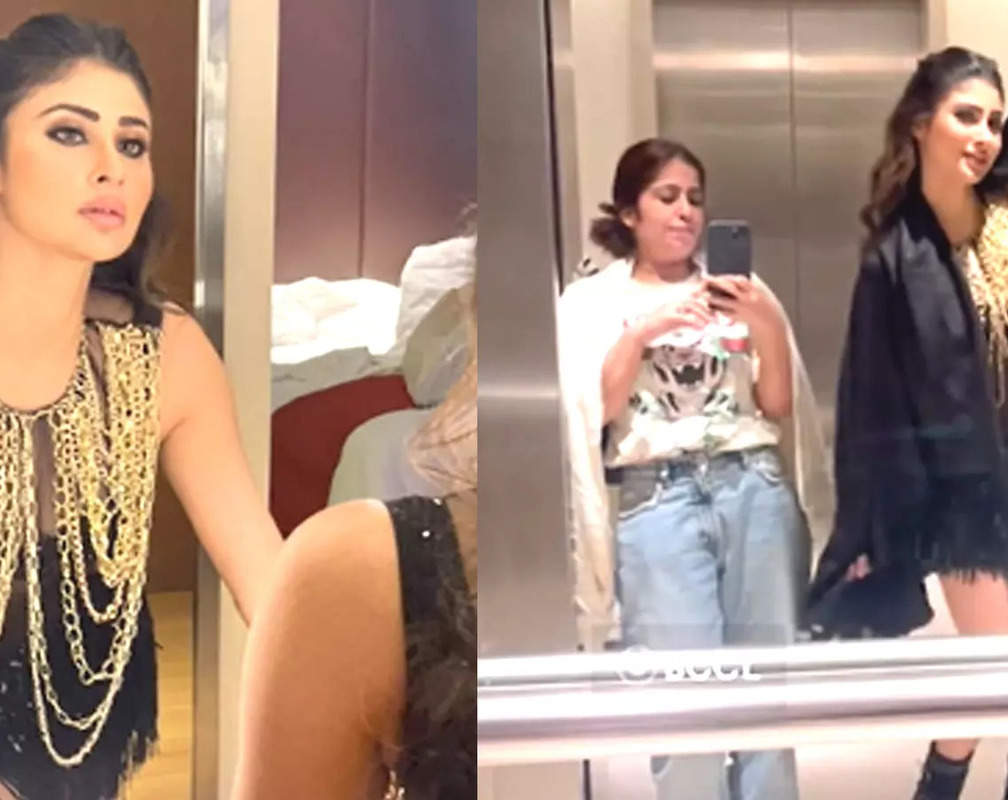 
Mouni Roy stuns in black shimmery outfit; check out her fun dance in a lift!
