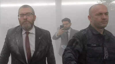 Far-right Polish lawmaker uses fire extinguisher on Hanukkah candles in parliament