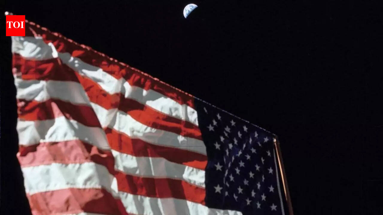 NASA shares 51-year-old photo of US flag on Moon with Earth in ...