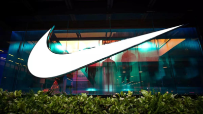 Nike shares falter as weak consumer spending prompts forecast cut