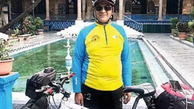 Iranian biker cuts across borders with call to recycle