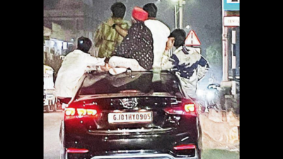 Viral: Man shows off his body out of moving car's sunroof in UP's Ghaziabad