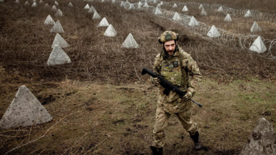 Ukraine builds barricades, digs trenches as focus shifts to defence