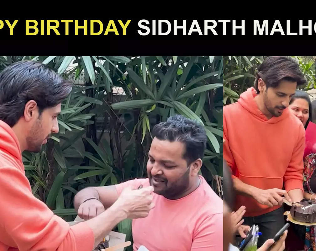 
Sidharth Malhotra celebrates his birthday by cutting a cake with fans and paparazzi
