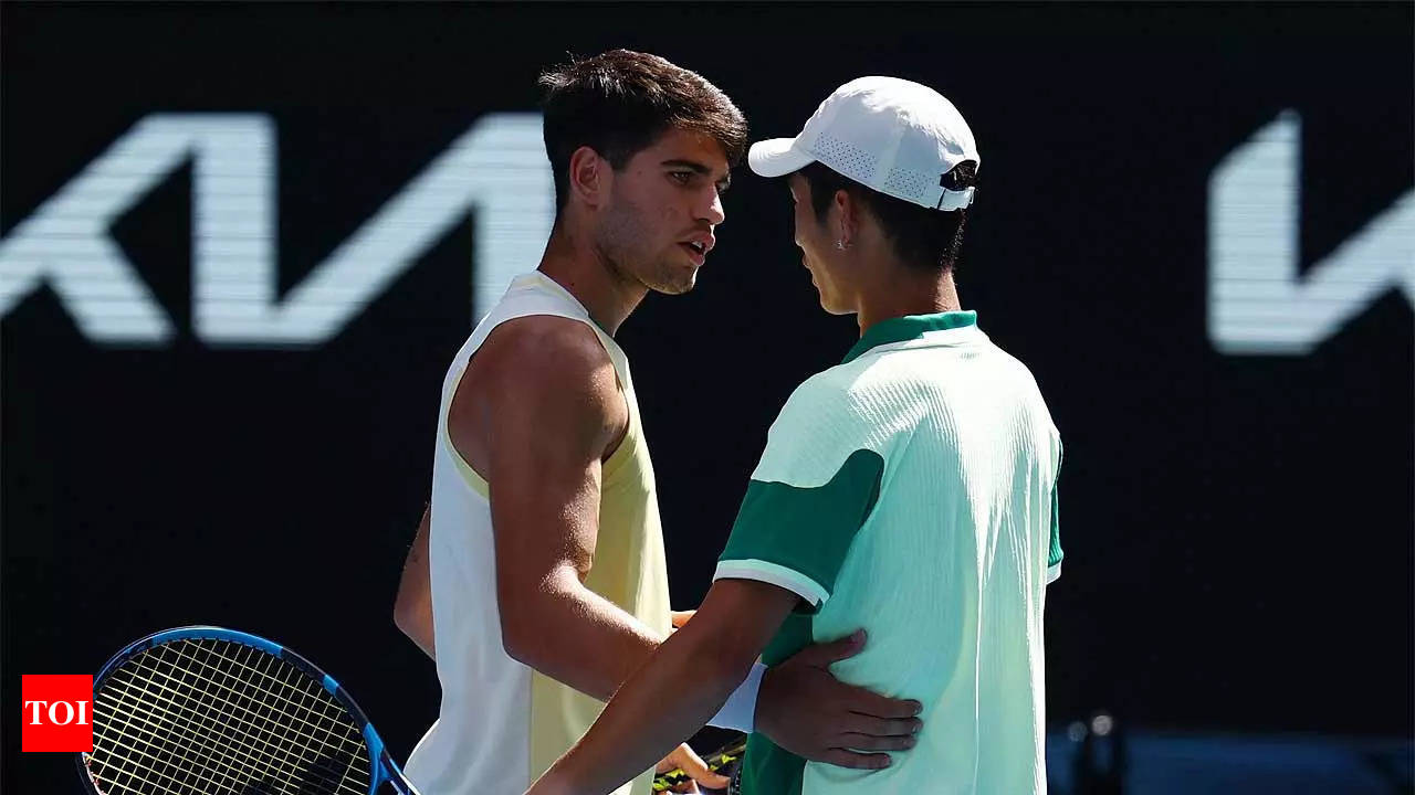 Carlos Alcaraz reaches last 16 at Australian Open as Shang Juncheng retires  | Tennis News - Times of India