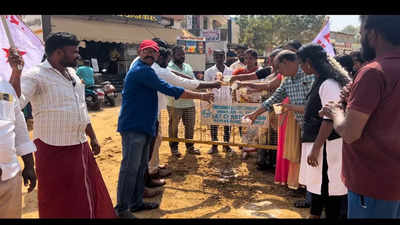 DYFI members pour milk to protest delay in completing underground drainage work in Trichy