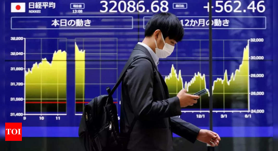 Japan’s Nikkei edges down on caution before earnings, profit-taking – Times of India