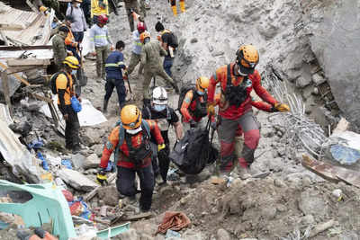 Philippines: Earthquake halts landslide rescue efforts - Times of India