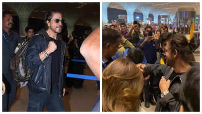 Fan kisses Shah Rukh Khan's hand as the superstar arrives at the airport in style - WATCH video